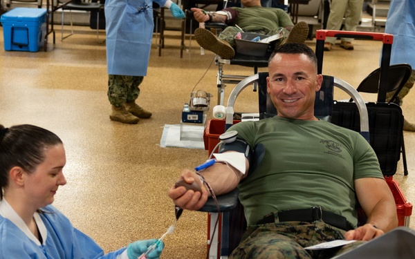 Lt. Col. Andrew Koch donates blood to save lives