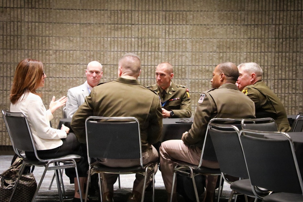 U.S. Army officers engage civilian leaders during DECA roundtable discussion