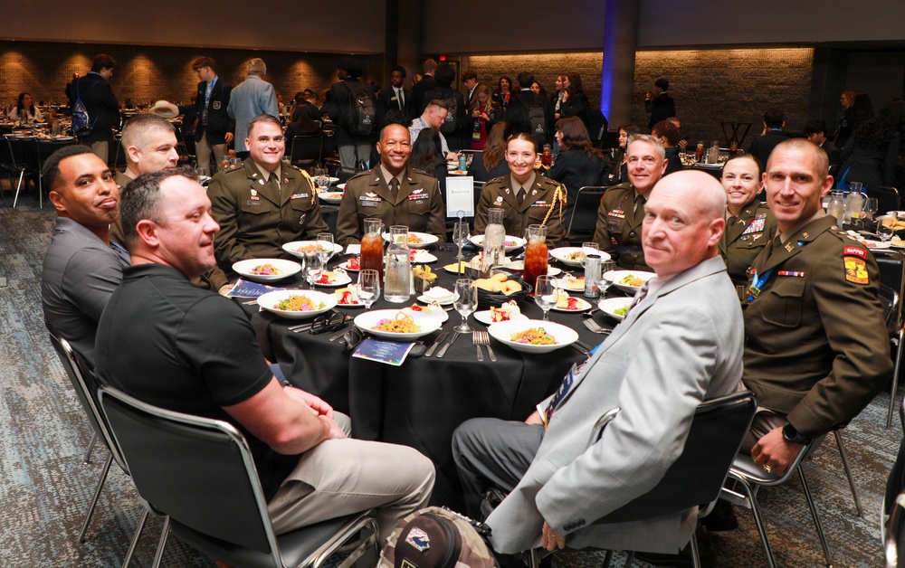 U.S. Army officers and civilian guests attend DECA formal dinner