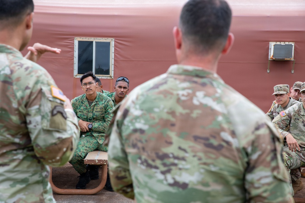 U.S. Soldiers and partner forces participate in brief prior to PLFTRC