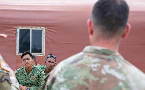 U.S. Soldiers and partner forces participate in brief prior to PLFTRC