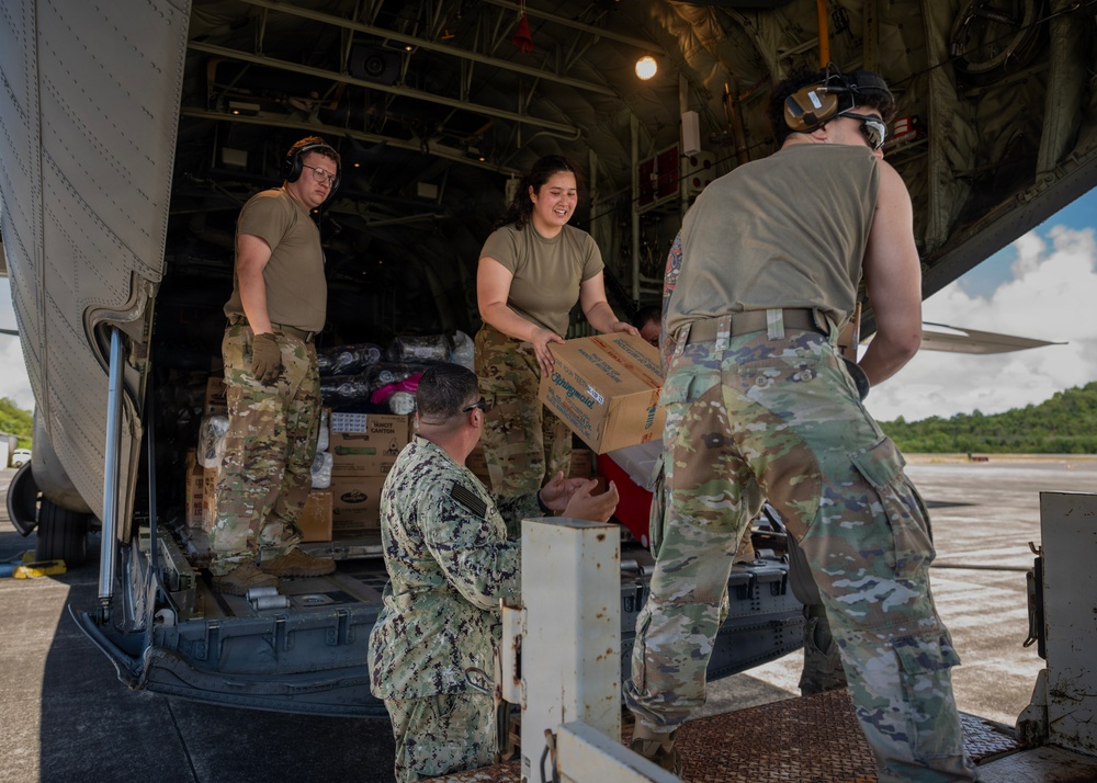 U.S. Air Force and Navy service members download medical supplies during Pac Angel 26-3