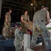 U.S. Air Force and Navy service members download medical supplies during Pac Angel 26-3