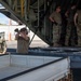 U.S. Air Force and Navy service members download medical supplies during Pac Angel 26-3