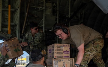U.S. Air Force and Navy service members download medical supplies during Pac Angel 26-3