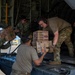 U.S. Air Force and Navy service members download medical supplies during Pac Angel 26-3