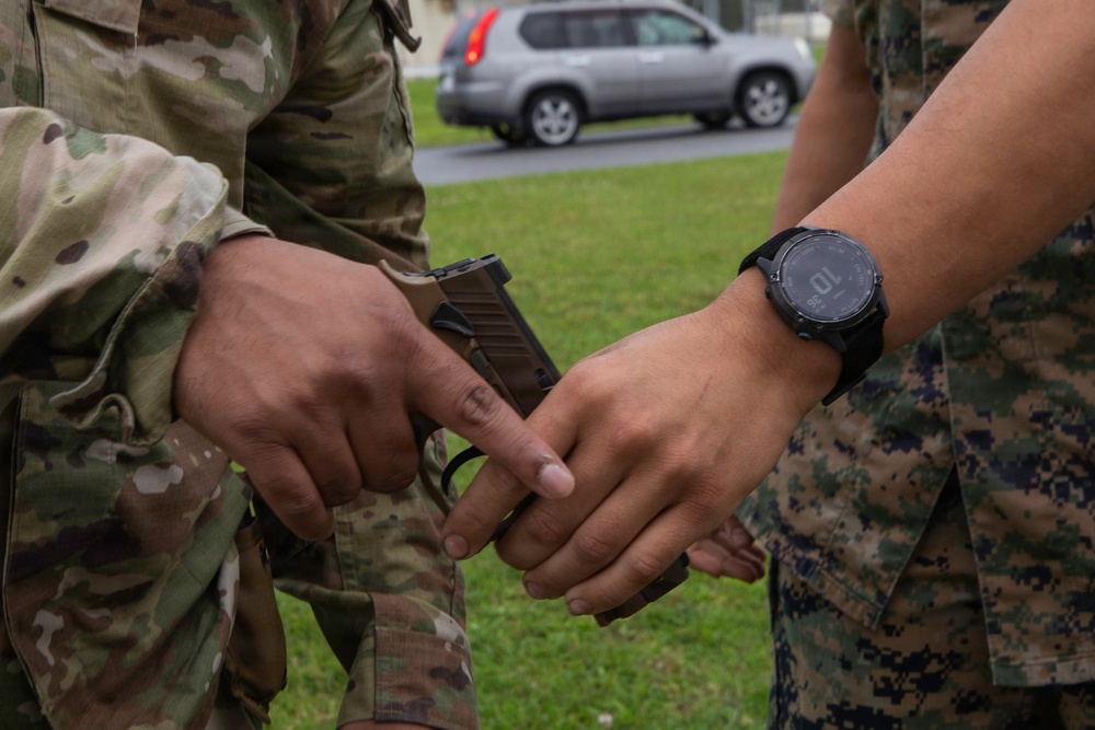 3rd Maintenance Battalion Combat Marksmanship Coaches Provide Pistol Familiarization to Space Force 161 Electromagnetic Warfare Combat Detachment