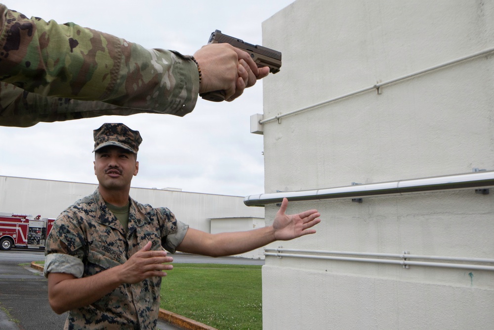 3rd Maintenance Battalion Combat Marksmanship Coaches Provide Pistol Familiarization to Space Force 161 Electromagnetic Warfare Combat Detachment