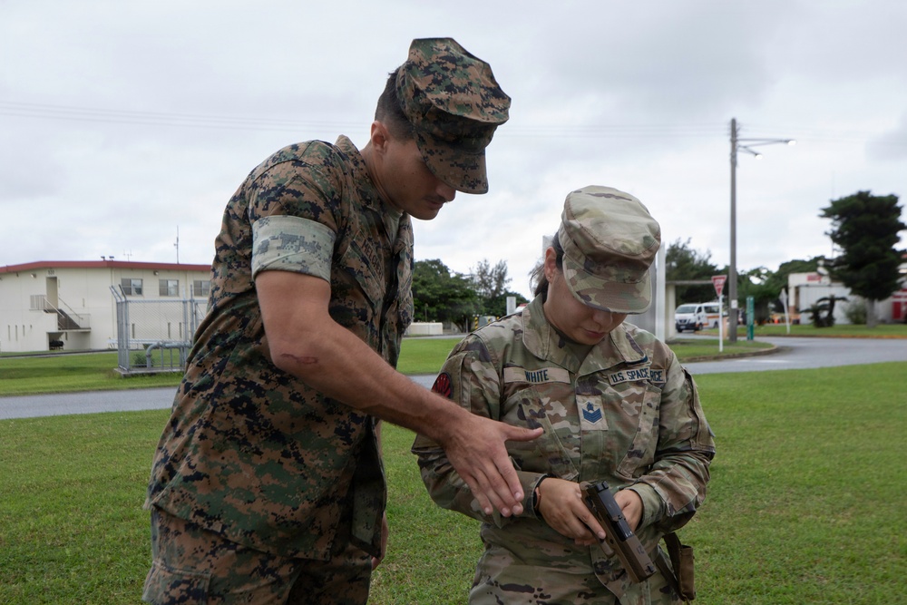 3rd Maintenance Battalion Combat Marksmanship Coaches Provide Pistol Familiarization to Space Force 161 Electromagnetic Warfare Combat Detachment