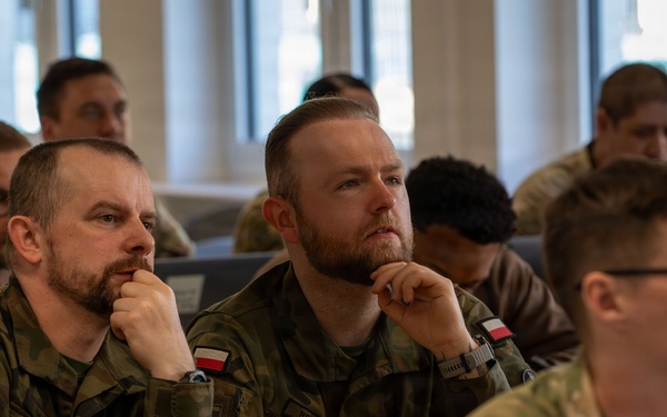U.S. and Polish Army Personnel Receive Challenge Coins During a Physical Security Officer Course