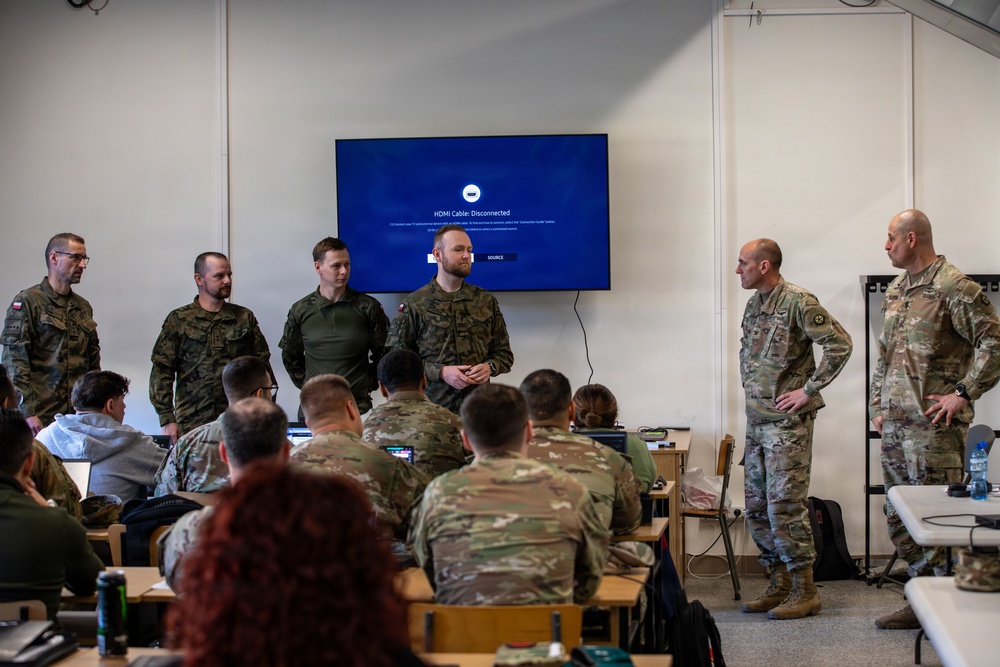 U.S. and Polish Army Personnel Receive Challenge Coins During a Physical Security Officer Course