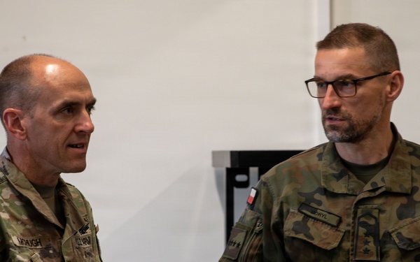 U.S. and Polish Army Personnel Receive Challenge Coins During a Physical Security Officer Course