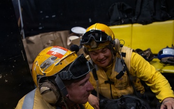 Boxer’s Morale Dog Comforts Sailors