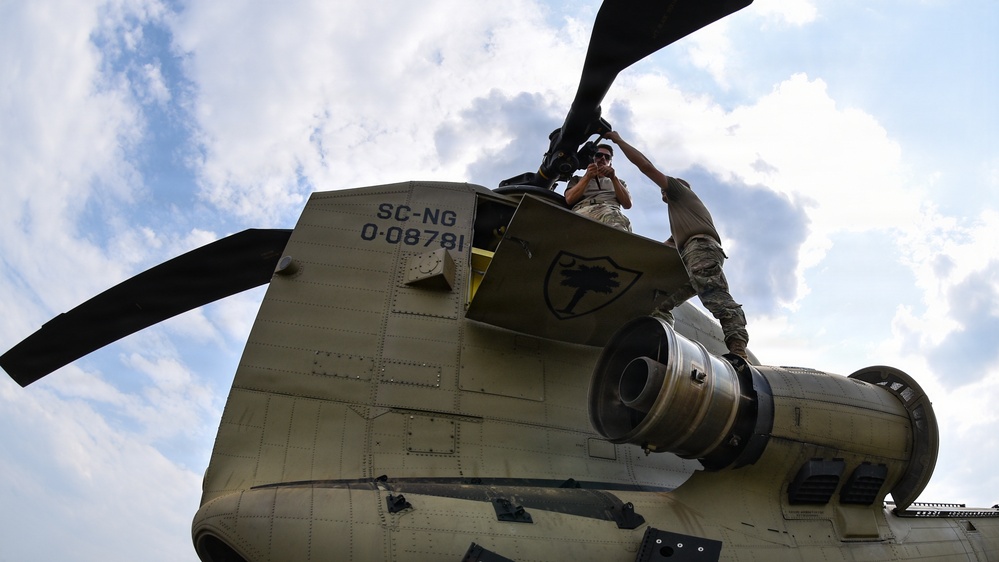 South Carolina National Guard Chinook unit recovers damaged aircraft from field in Savannah