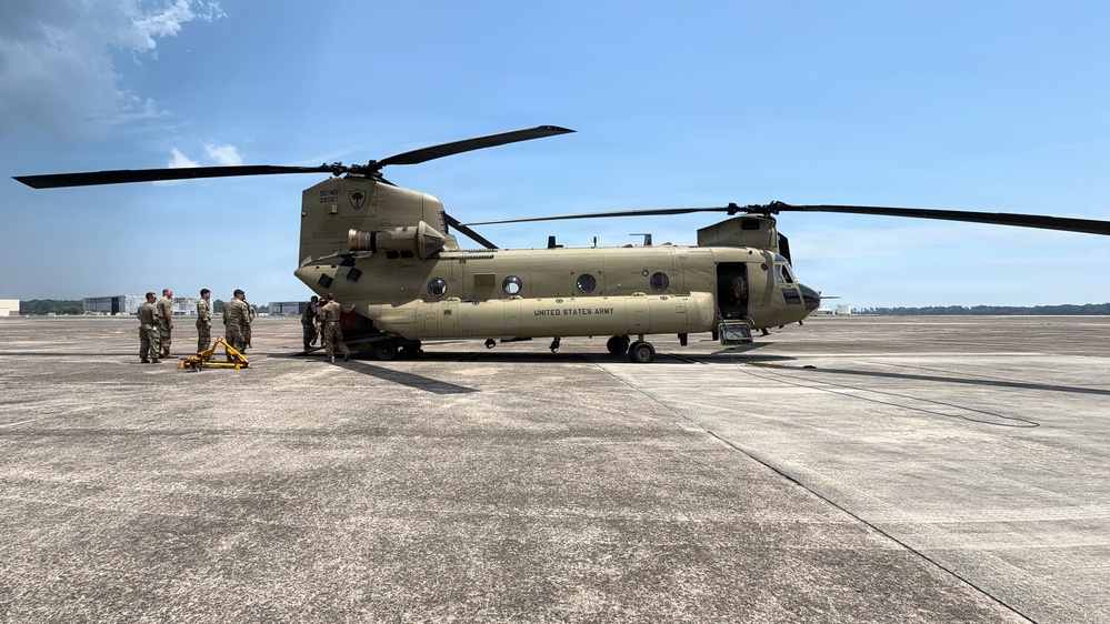 South Carolina National Guard Chinook unit recovers damaged aircraft from field in Savannah