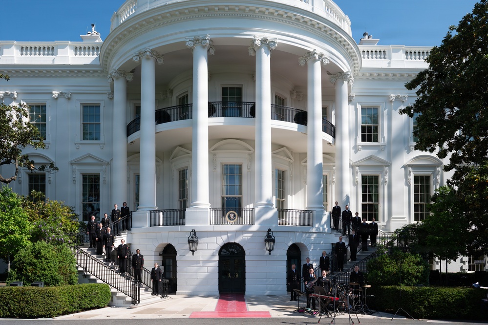 Navy Band Sea Chanters rehearse for arrival of King Charles III