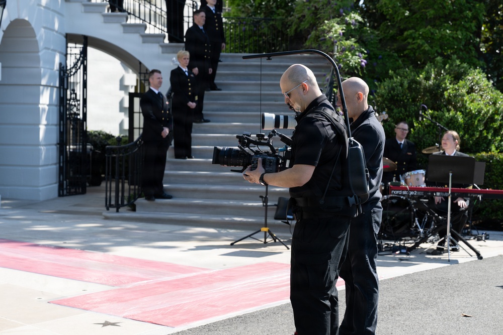 Navy Band Sea Chanters rehearse for arrival of King Charles III