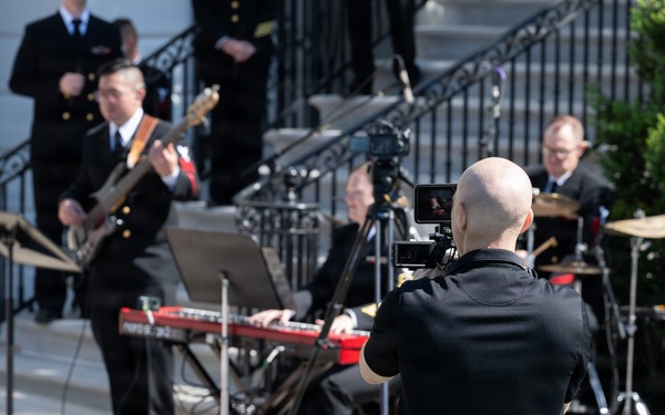 Navy Band Sea Chanters rehearse for arrival of King Charles III