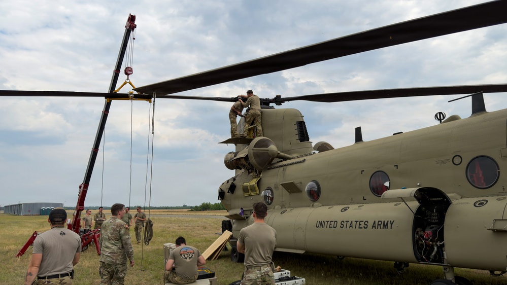 South Carolina National Guard Chinook unit recovers damaged aircraft from field in Savannah