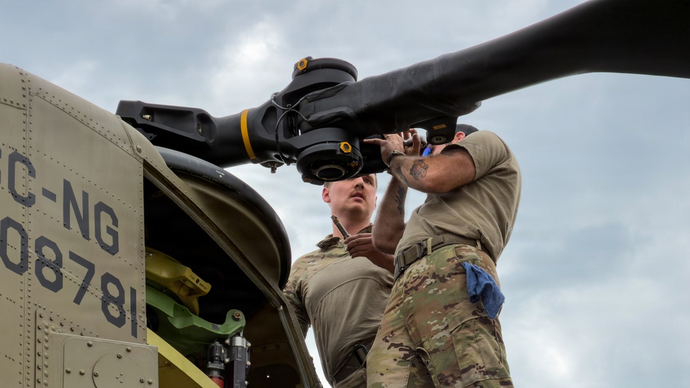 South Carolina National Guard Chinook unit recovers damaged aircraft from field in Savannah