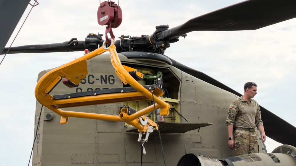 South Carolina National Guard Chinook unit recovers damaged aircraft from field in Savannah