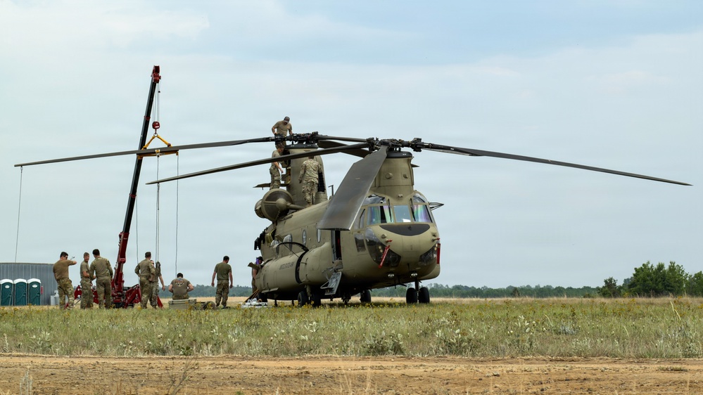 South Carolina National Guard Chinook unit recovers damaged aircraft from field in Savannah