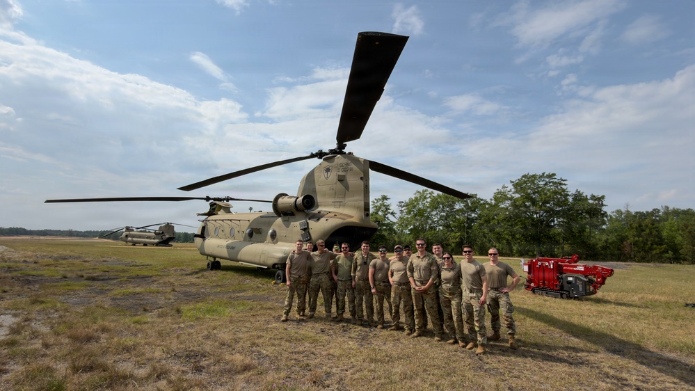 South Carolina National Guard Chinook unit recovers damaged aircraft from field in Savannah