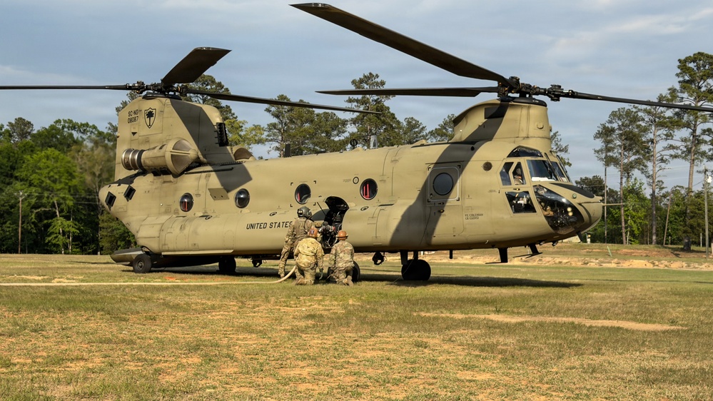 South Carolina National Guard Chinook unit recovers damaged aircraft from field in Savannah