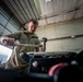 Wyoming Air National Guard member operates torque wrench during diesel repair