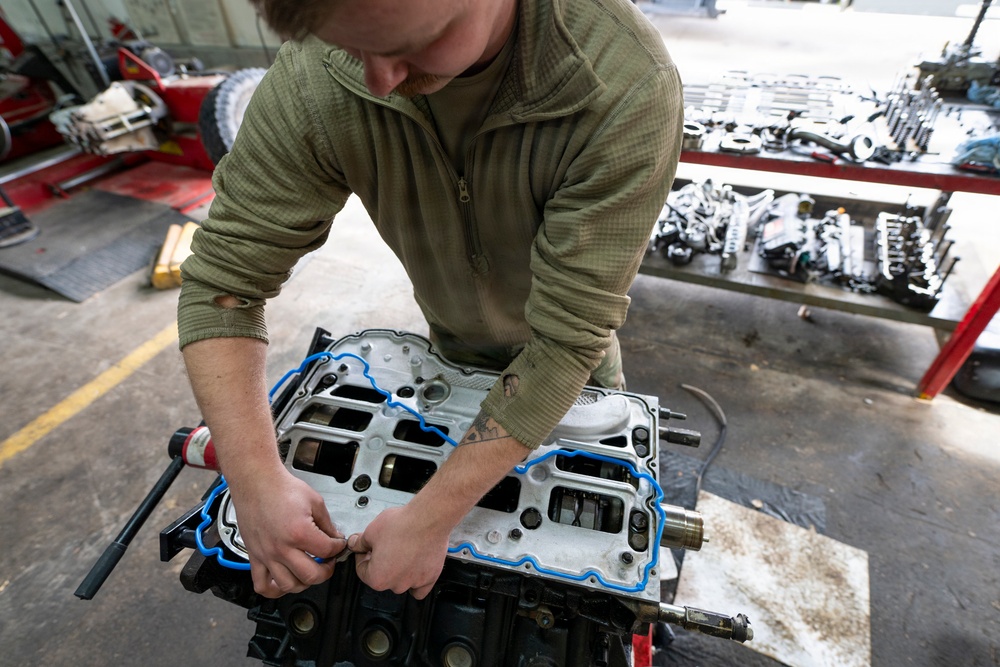 Wyoming Air National Guard maintenance specialist repairs diesel engine