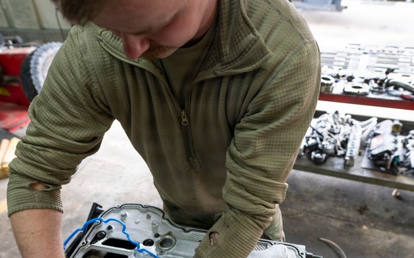 Wyoming Air National Guard maintenance specialist repairs diesel engine