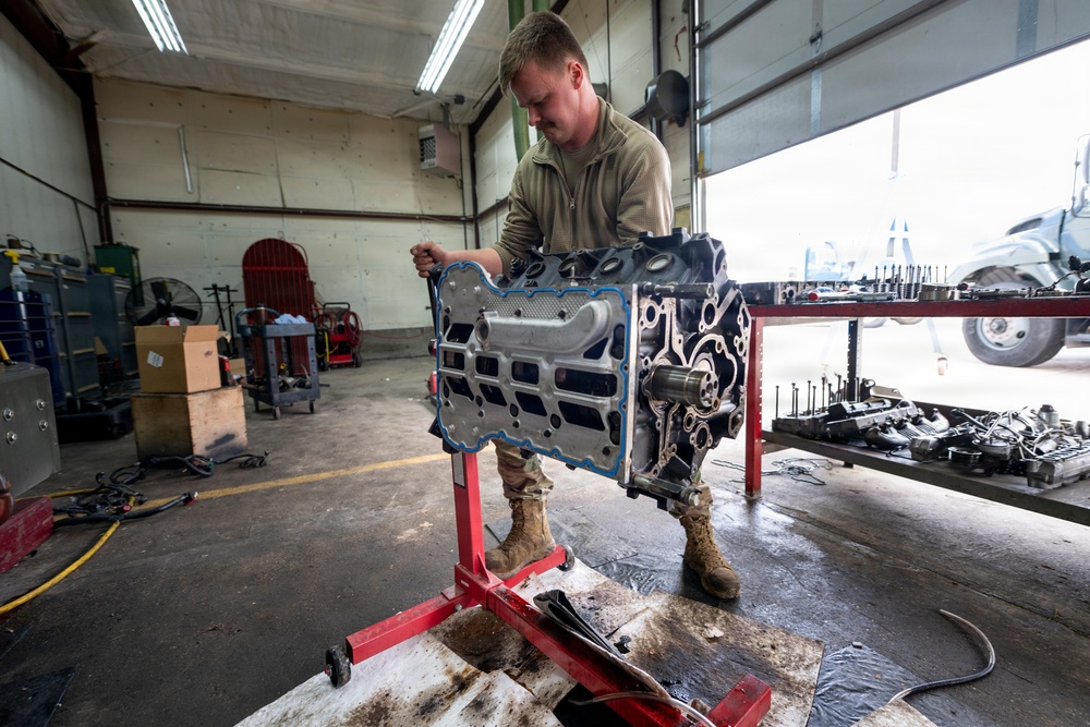 Wyoming Air National Guard maintenance specialist rotates diesel engine
