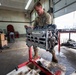 Wyoming Air National Guard maintenance specialist rotates diesel engine