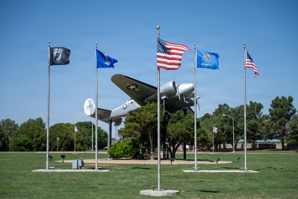 Flags on display next to C-45 Beech passenger aircraft