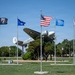 Flags on display next to C-45 Beech passenger aircraft