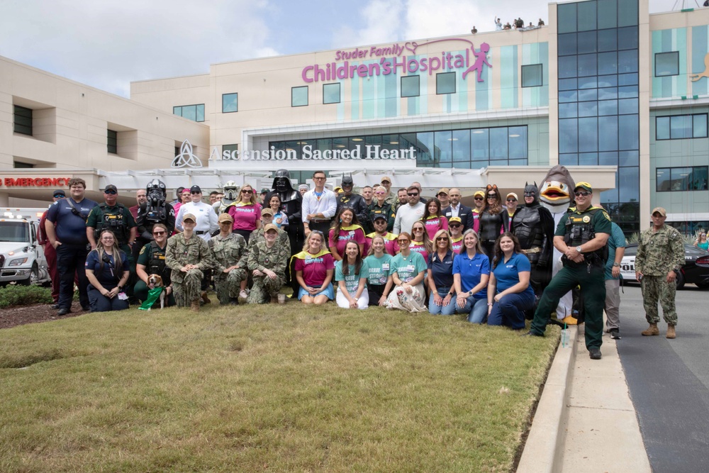Pensacola Service Members Visit Hospital for National Superhero Day