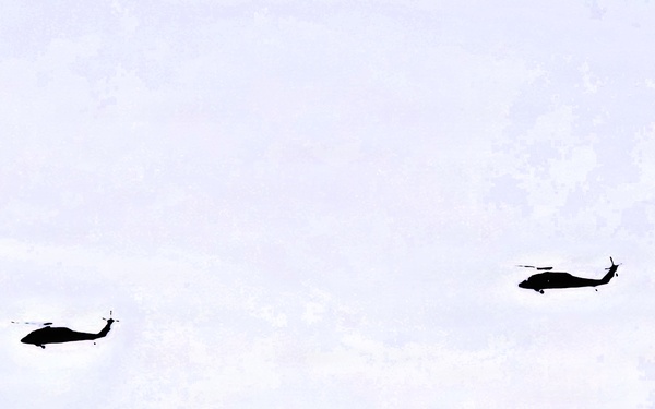 Wisconsin National Guard UH-60 Black Hawks fly members of Packers tour to Fort McCoy