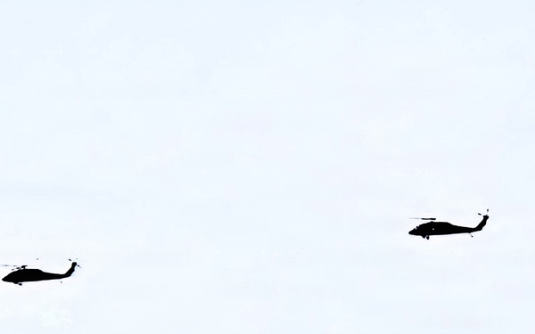 Wisconsin National Guard UH-60 Black Hawks fly members of Packers tour to Fort McCoy