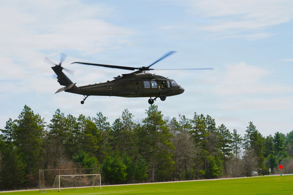 Wisconsin National Guard UH-60 Black Hawks fly members of Packers tour to Fort McCoy