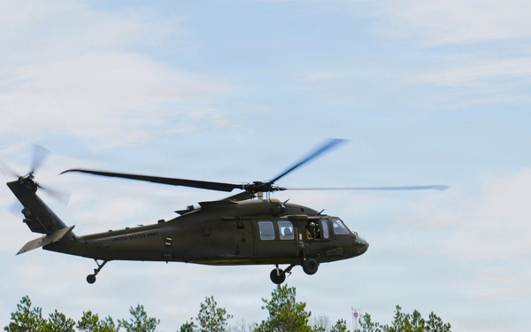 Wisconsin National Guard UH-60 Black Hawks fly members of Packers tour to Fort McCoy