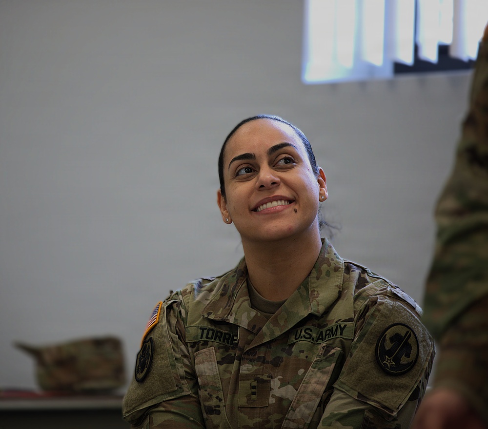 U.S. Army soldier smiles during indoor training