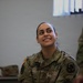 U.S. Army soldier smiles during indoor training