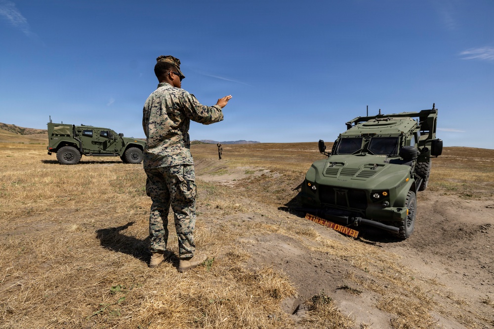 U.S. Marines take the wheel during JLTV operator course