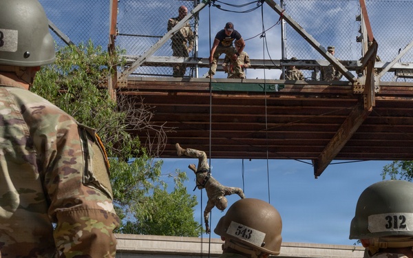 JTF-SB service members rappel from bridge during Air Assault training