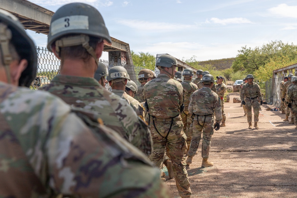 JTF-SB service members rappel from bridge during Air Assault training