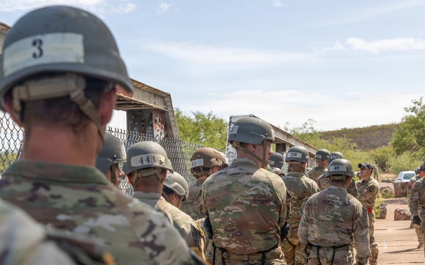 JTF-SB service members rappel from bridge during Air Assault training
