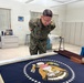 Sergeant Major of the Marine Corps Carlos Ruiz examines a nearly completed Presidential flag during a visit to Defense Logistics Agency Troop Support in Philadelphia on April 27. His visit included a tour of the flag room.