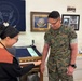 Sergeant Major of the Marine Corps Carlos Ruiz examines a nearly completed Presidential flag during a visit to Defense Logistics Agency Troop Support in Philadelphia on April 27.