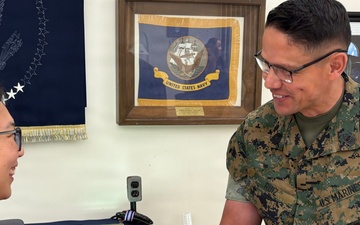 Sergeant Major of the Marine Corps Carlos Ruiz examines a nearly completed Presidential flag during a visit to Defense Logistics Agency Troop Support in Philadelphia on April 27.