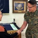 Sergeant Major of the Marine Corps Carlos Ruiz examines a nearly completed Presidential flag during a visit to Defense Logistics Agency Troop Support in Philadelphia on April 27.